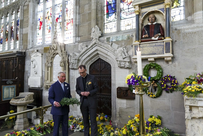 Prince Charles lays a wreath on the grave of William Shakespeare in Holy Trinity Church.