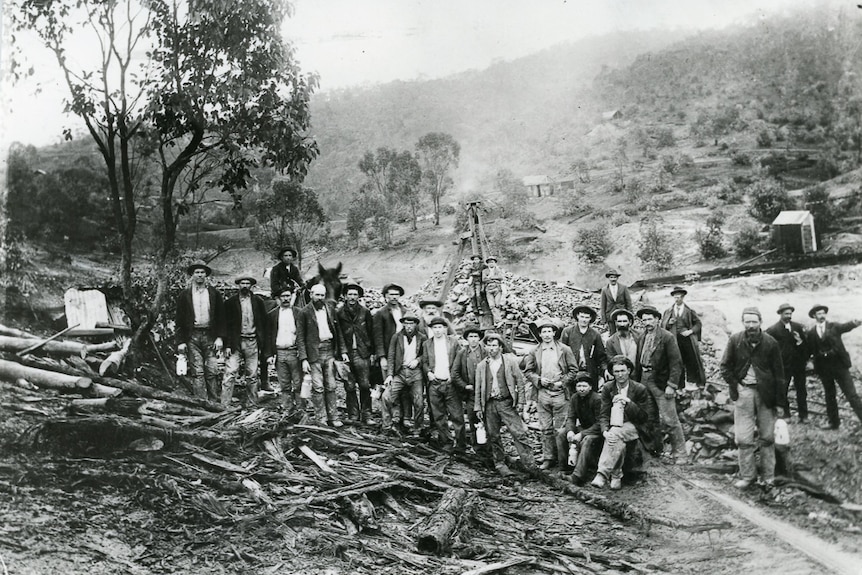 A group of men standing at a mine.