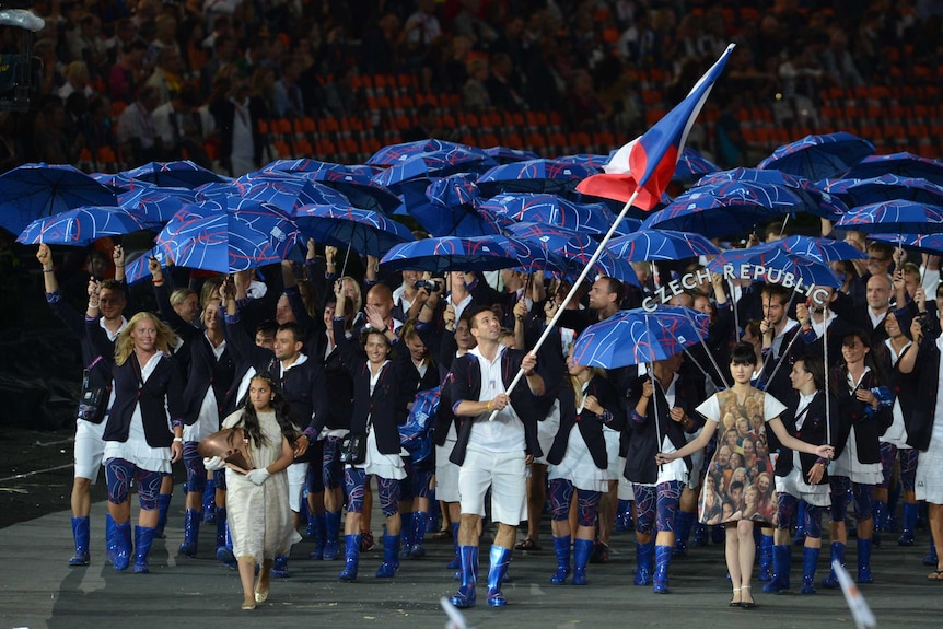Czech Republic's flagbearer Petr Koukal (C) leads his delegation during the opening ceremony of the London 2012
