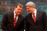 Canadian foreign minister John Baird (L) and Canadian prime minister Stephen Harper