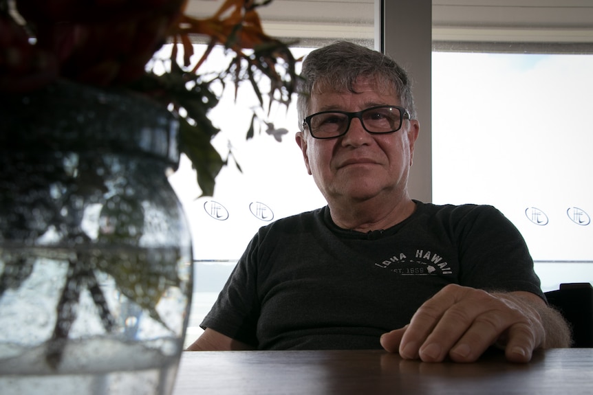 Man sits at dining table