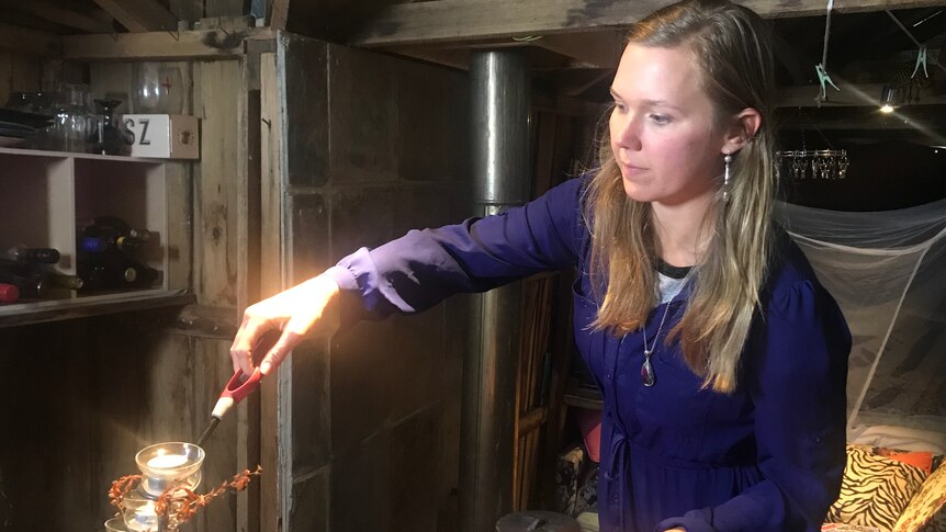 Victoria O'Sullivan lighting candles.