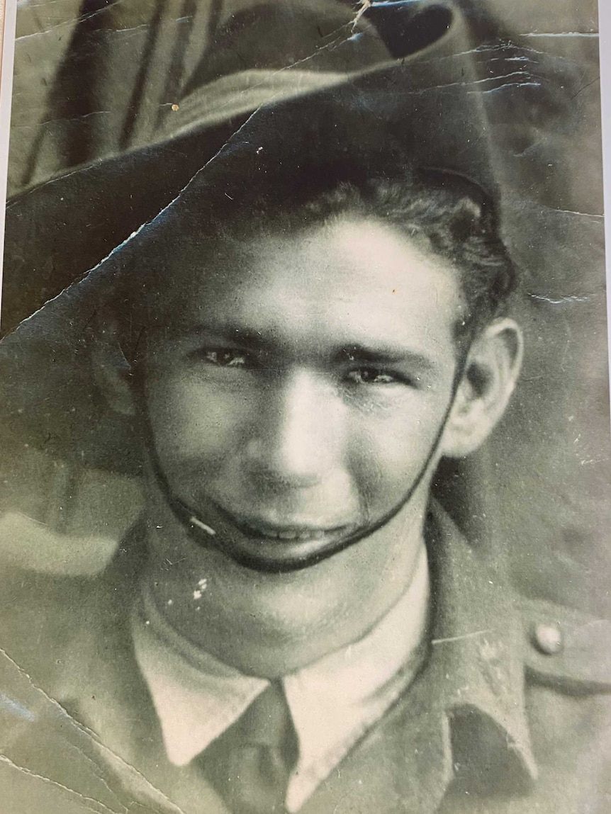 Black and white photo in frame of young man in slouch hat