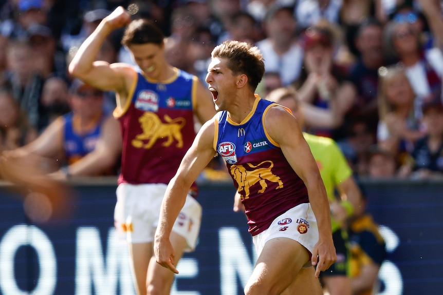 A Brisbane Lions AFL player celebrates a goal in the grand final.