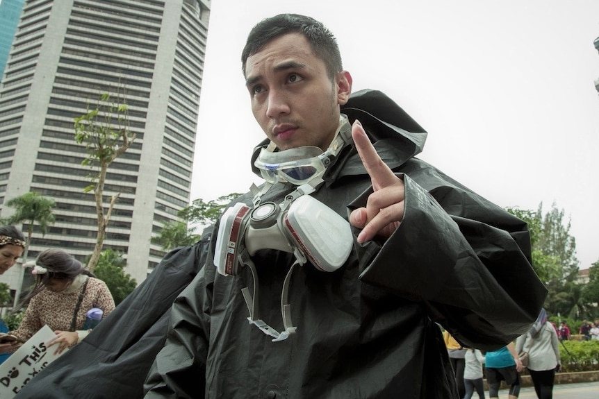 A man on the street doing a protest