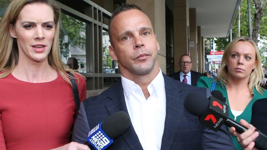 Former AFL player Jake King leaves the Melbourne Magistrate Court in Melbourne.