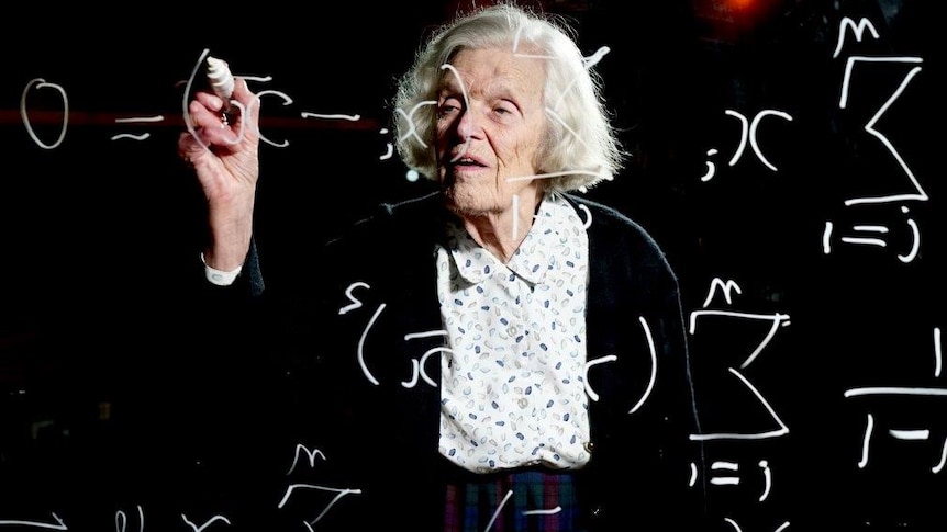 Alison Harcourt works on a maths equation on a glassboard