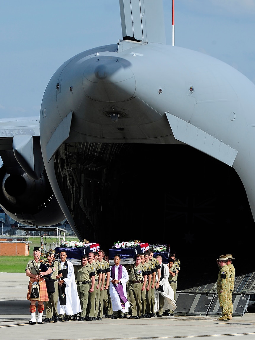 Bearer Parties carry the caskets of fallen soldiers Captain Bryce Duffy, Corporal Ashley Birt and Lance Corporal Luke Gavin.