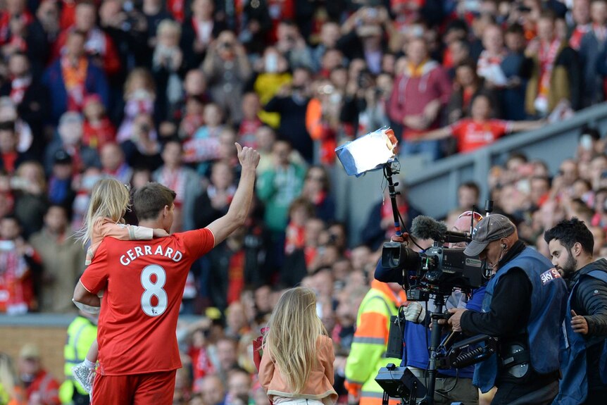 Steven Gerrard waves to the fans after his last Liverpool game