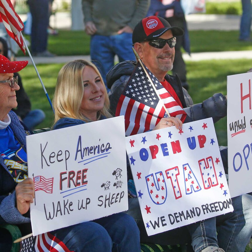 People gather for a protest calling for the US state of Utah's economy to be reopened.