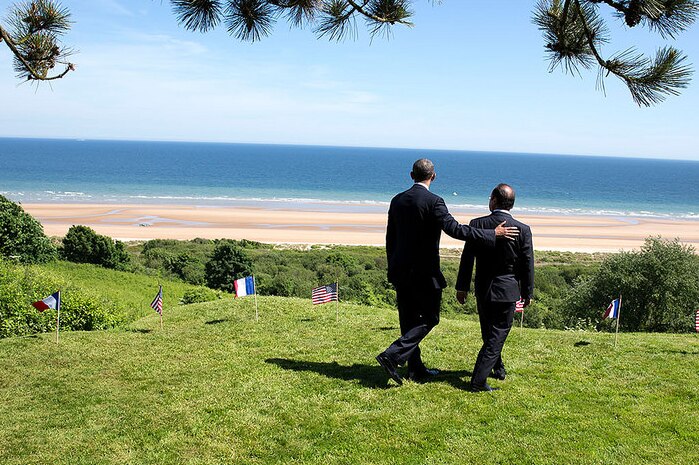President Barack Obama and Francois Hollande walk to the bluffs overlooking Omaha Beach.