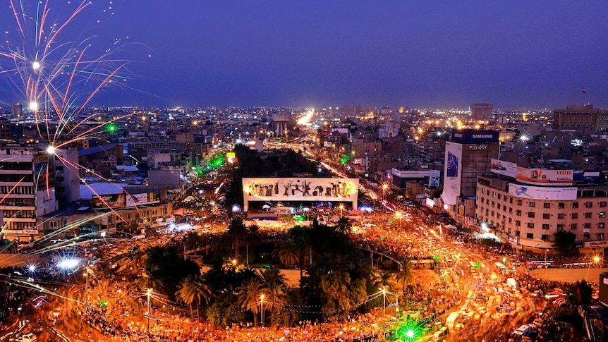 Tahir Square at night, with thousand of protesters holding up glowing phones