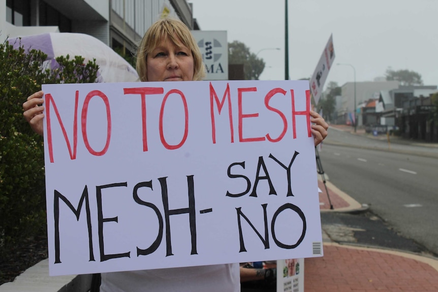 Pelvic mesh implant recipient Sue Turner protesting outside the AMA offices in Perth