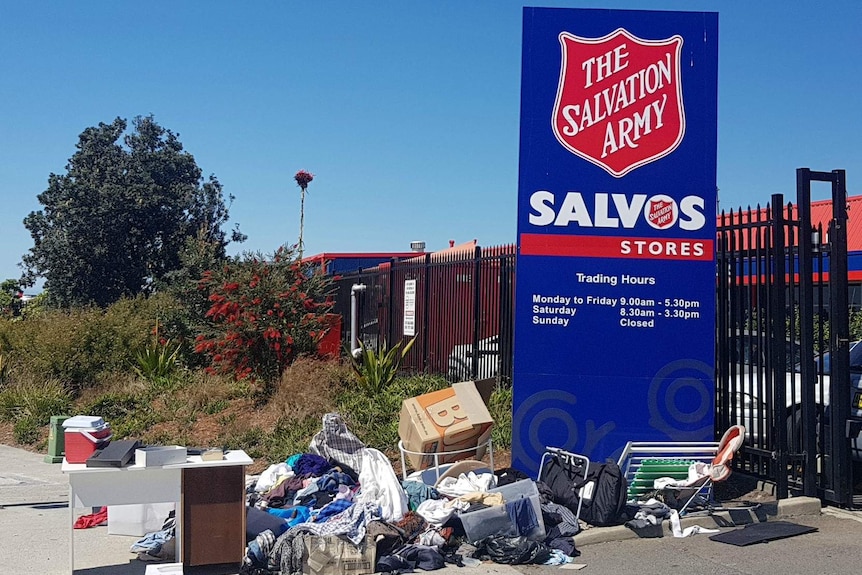 A pile of stuff sits on the footpath outside a Salvation Army building in Sydney.