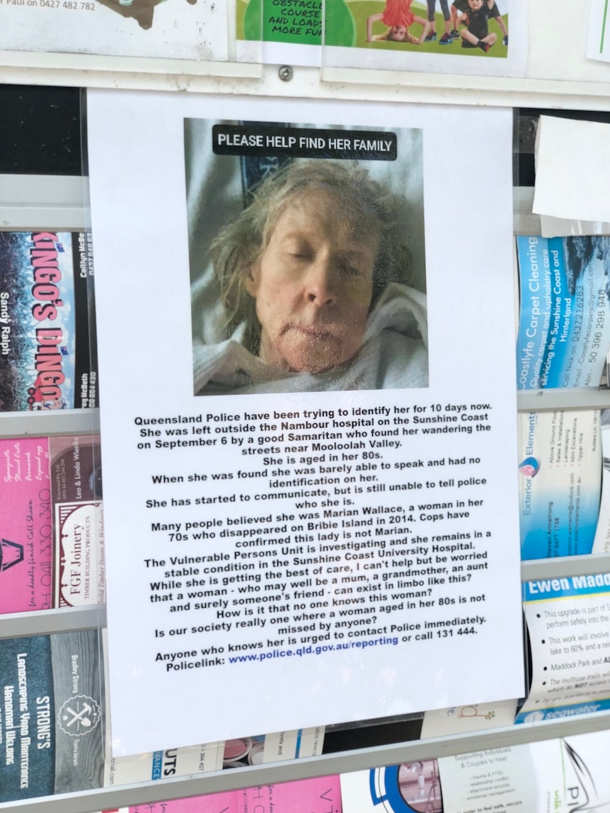 A sign with a picture of an elderly woman, hanging on a community notice board