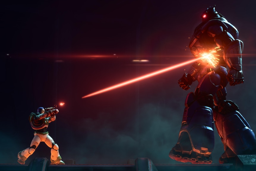Animated man in space suit shoots a red laser beam up at a giant chrome animatronic robot with glowing red eyes.