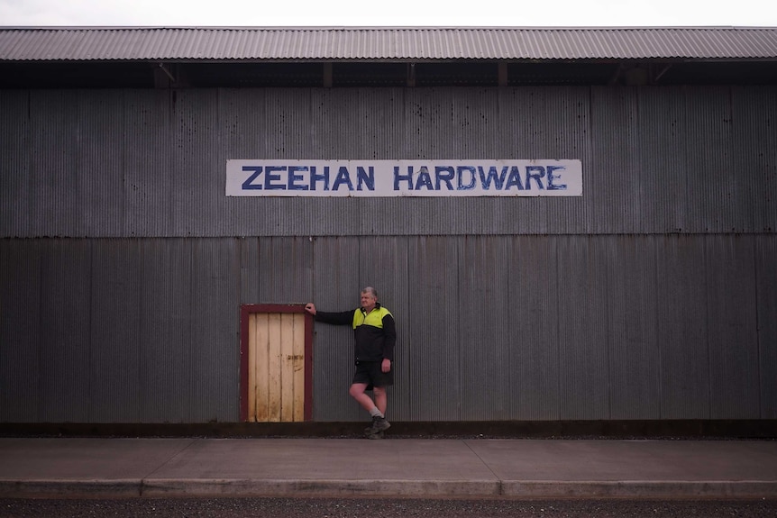 Zeehan hardware store owner, Don Edmonston, stands outside his business.