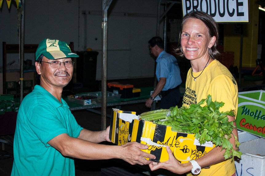 REAP volunteer Jenny with farmer Ricky Lee