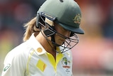Ellyse Perry leaves the field with her head down