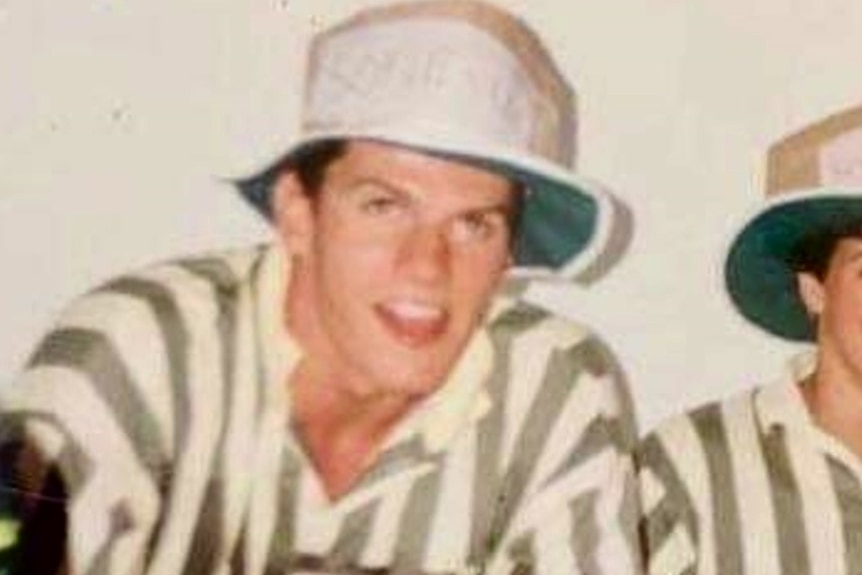 Young handsome man wearing a cricket hat.