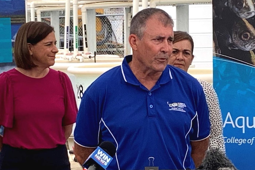 A man talking earnestly to the media at a press conference