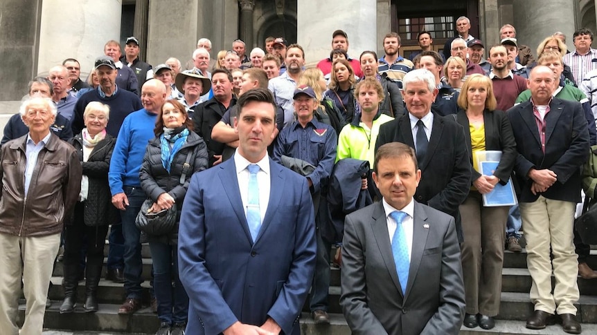 MPs with farmers outside SA Parliament after voting on Mining Act