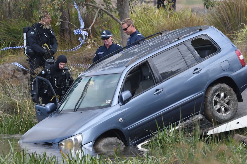 Police divers retrieve the vehicle that plunged into Lake Gladman in Wyndham Vale.