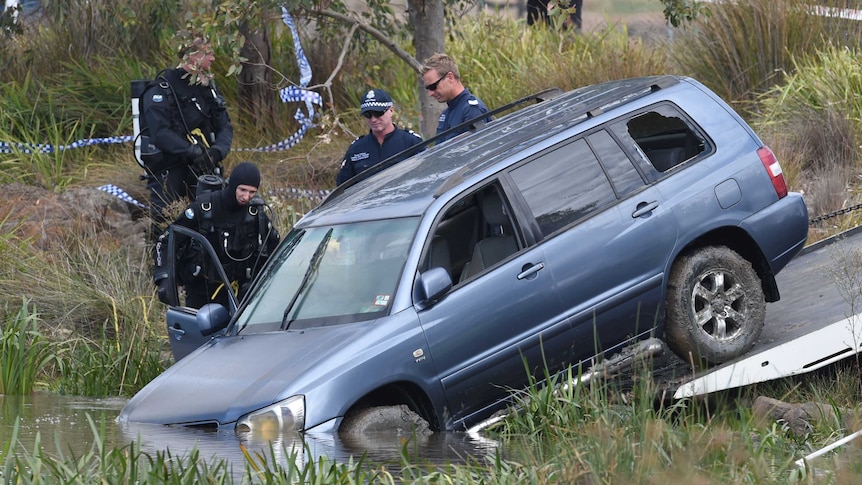 Police divers retrieve the vehicle that plunged into Lake Gladman in Wyndham Vale.