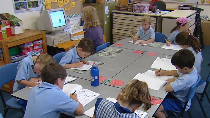 Primary children in school with teacher