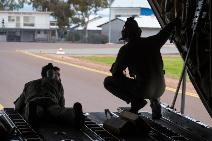SGT Morro and WOFF Bowden help reverse park the Hercules at Port Augusta.