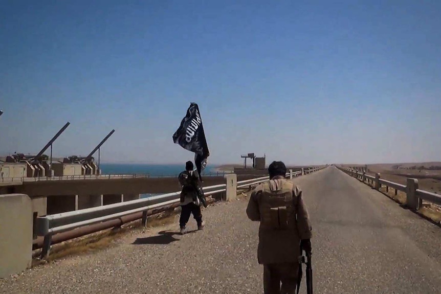 Islamic State militants at a Mosul dam