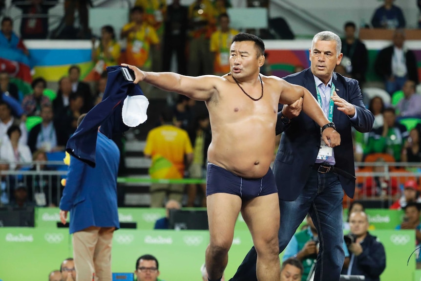 Mongolian coach strips off in protest of wrestling decision