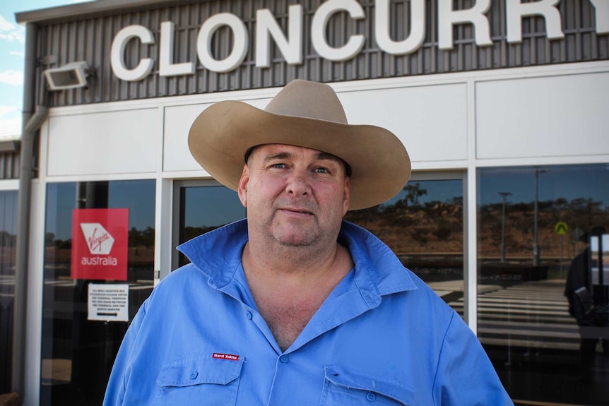 Hamish Griffin standing in a wide-brim hat out the front of the Cloncurry airport.