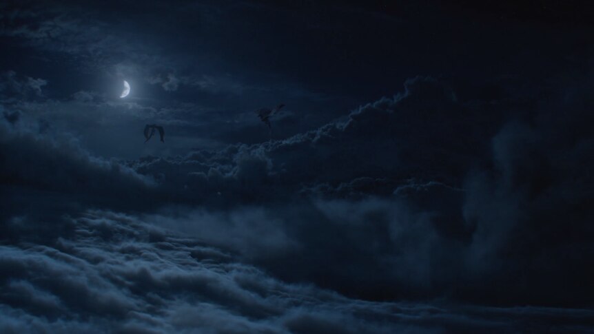 Two dragons loom in the sky in the still image from HBO's Game of Thrones