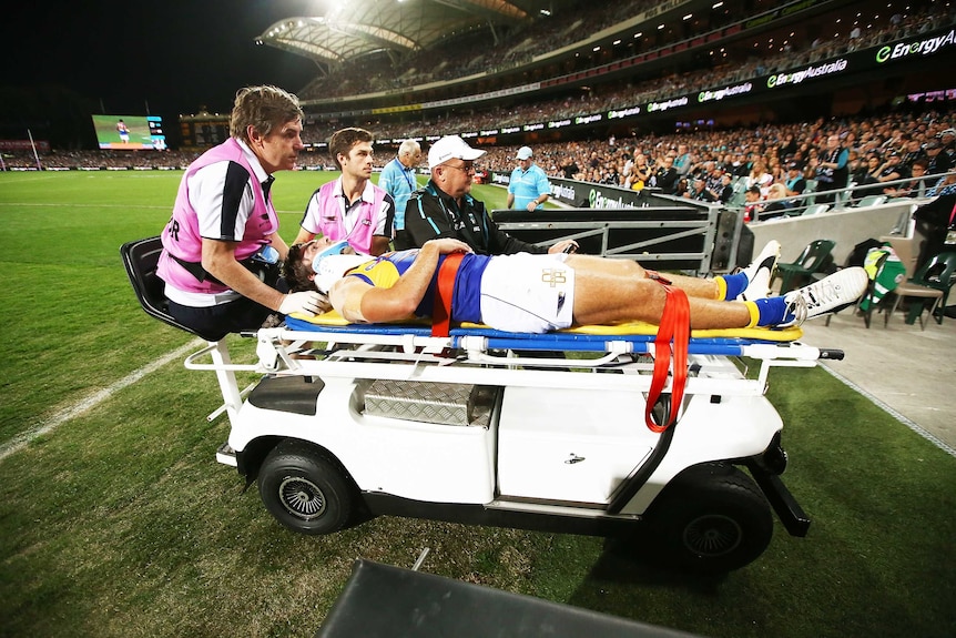 West Coast Eagles' Andrew Gaff is stretchered off against Port Adelaide at Adelaide Oval.