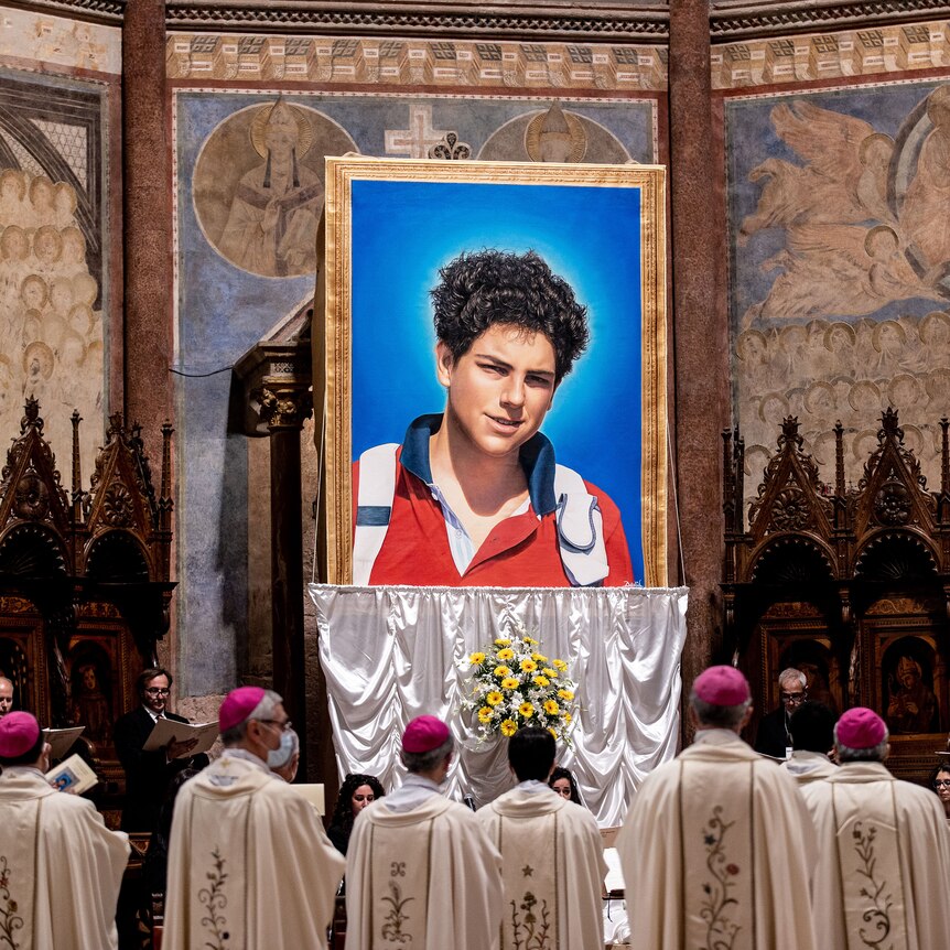 A tapestry featuring a portrait of teenager Carlo Acutis who is set to become the first millennial saint 