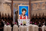 A tapestry featuring a portrait of teenager Carlo Acutis who is set to become the first millennial saint 
