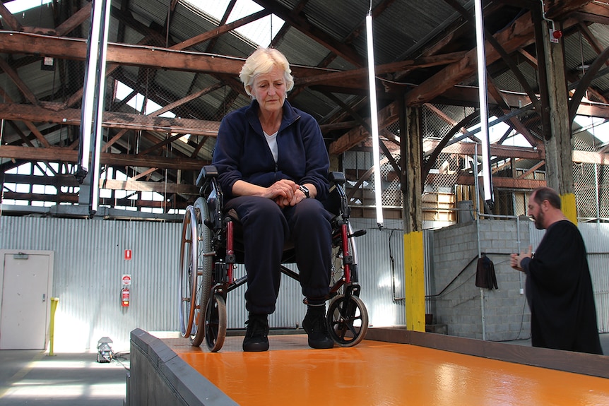 A woman in a wheelchair.