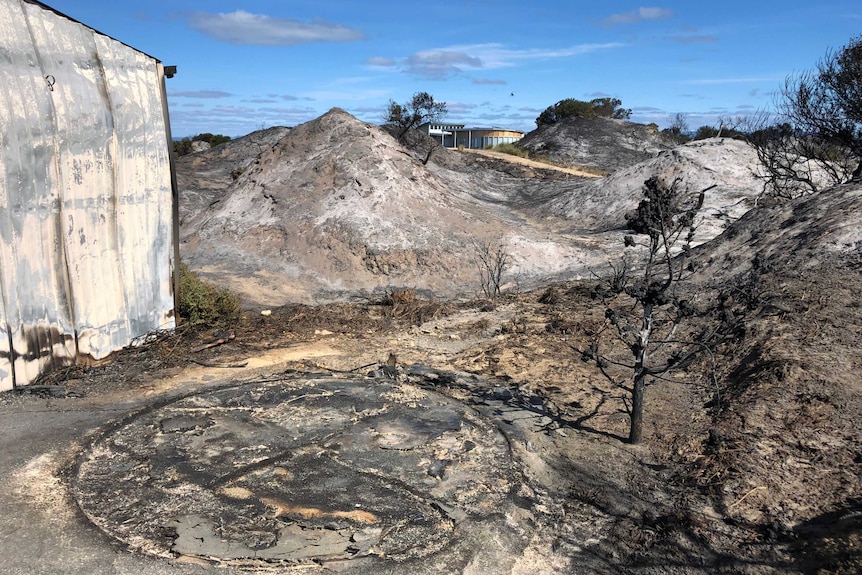Burned ground area near properties in Dolphin Sands, Tasmania, 10th April 2019
