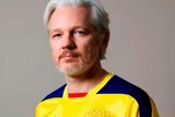 Julian Assange wears an Ecuador football jersey.