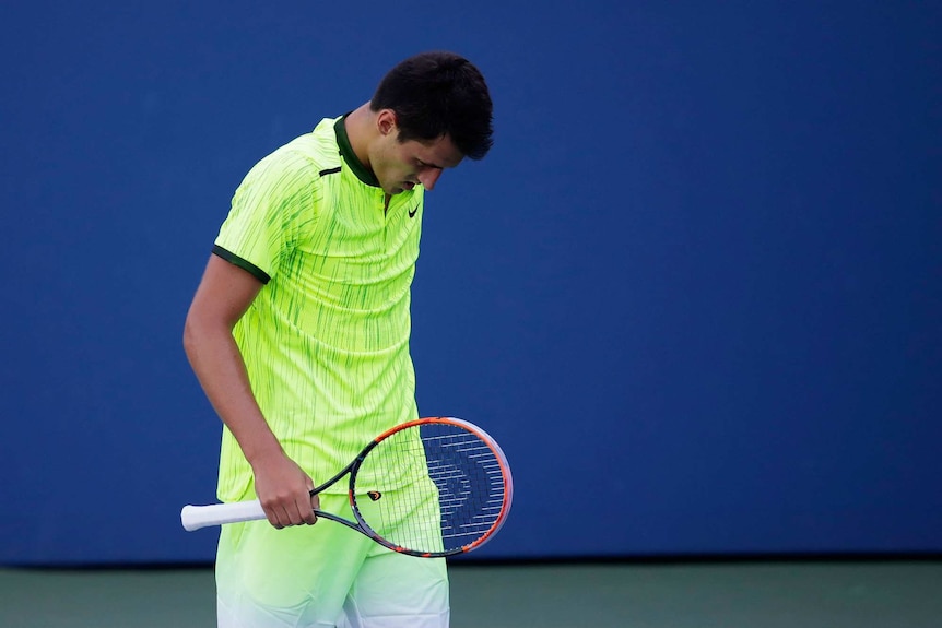 Bernard Tomic looks downcast