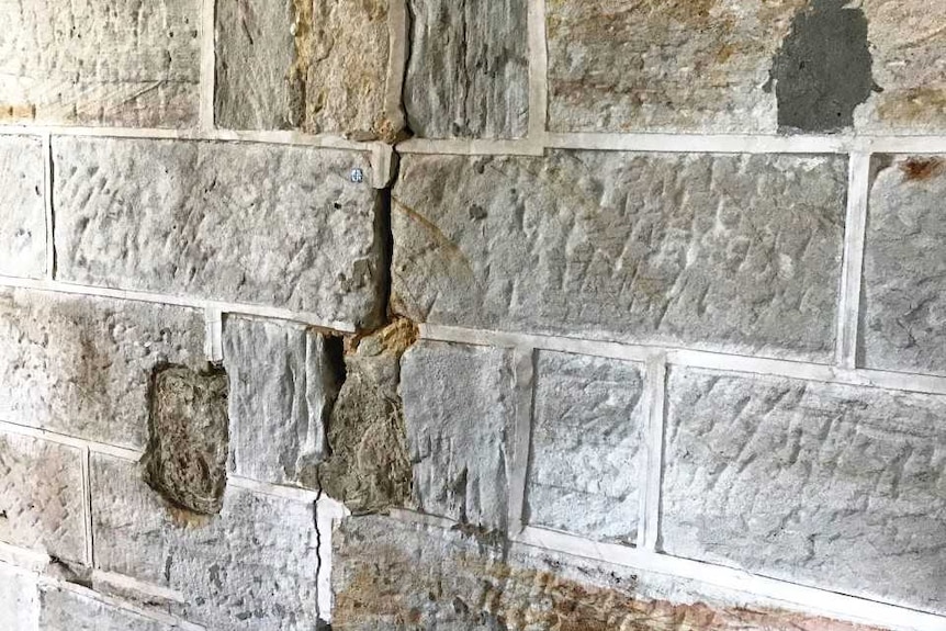 A cracked brick wall