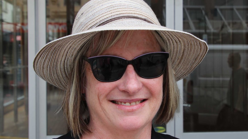 A headshot of Trevallyn woman Susan Ord wearing a hat in Launceston's CBD.
