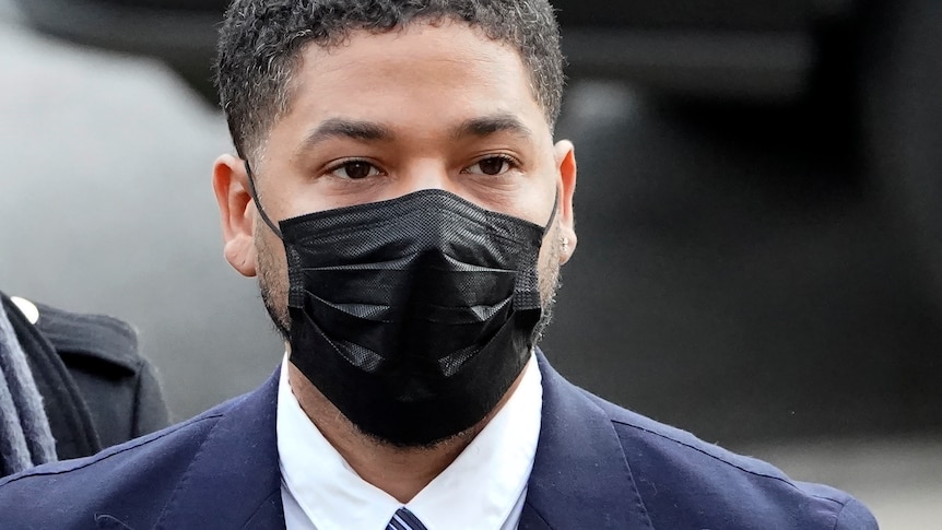 Jussie Smollett, a Black man wearing a mask