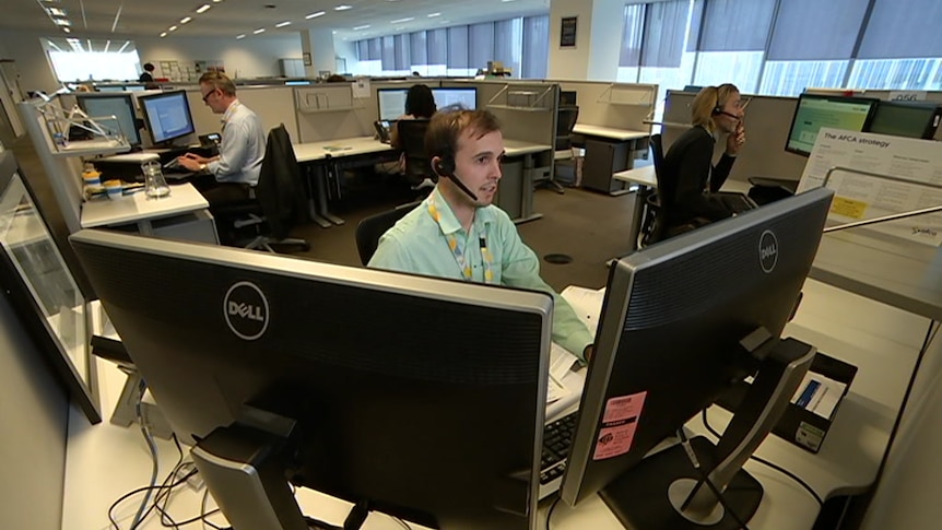 Workers answer phones at the Australian Financial Complaints Authority office.