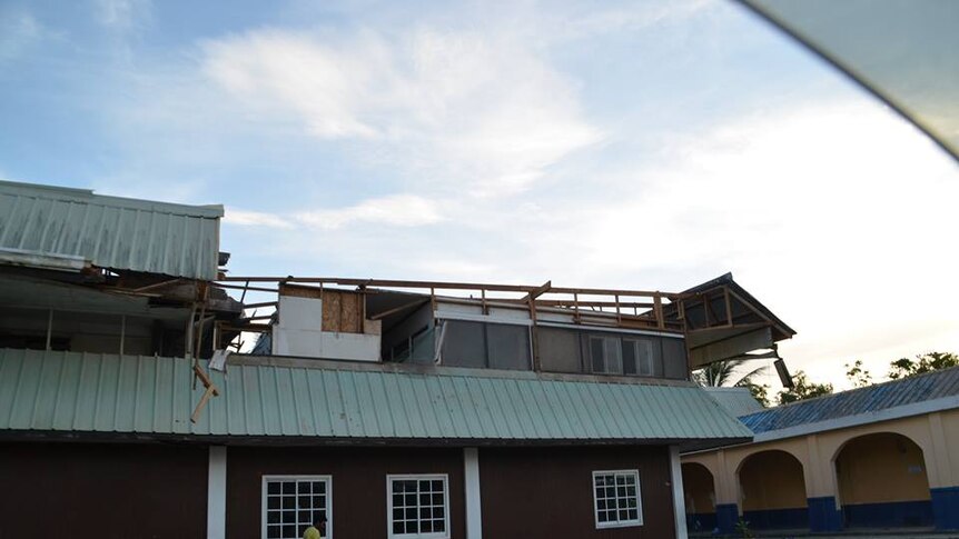 A house with roof torn off by Super Typhoon Maysak