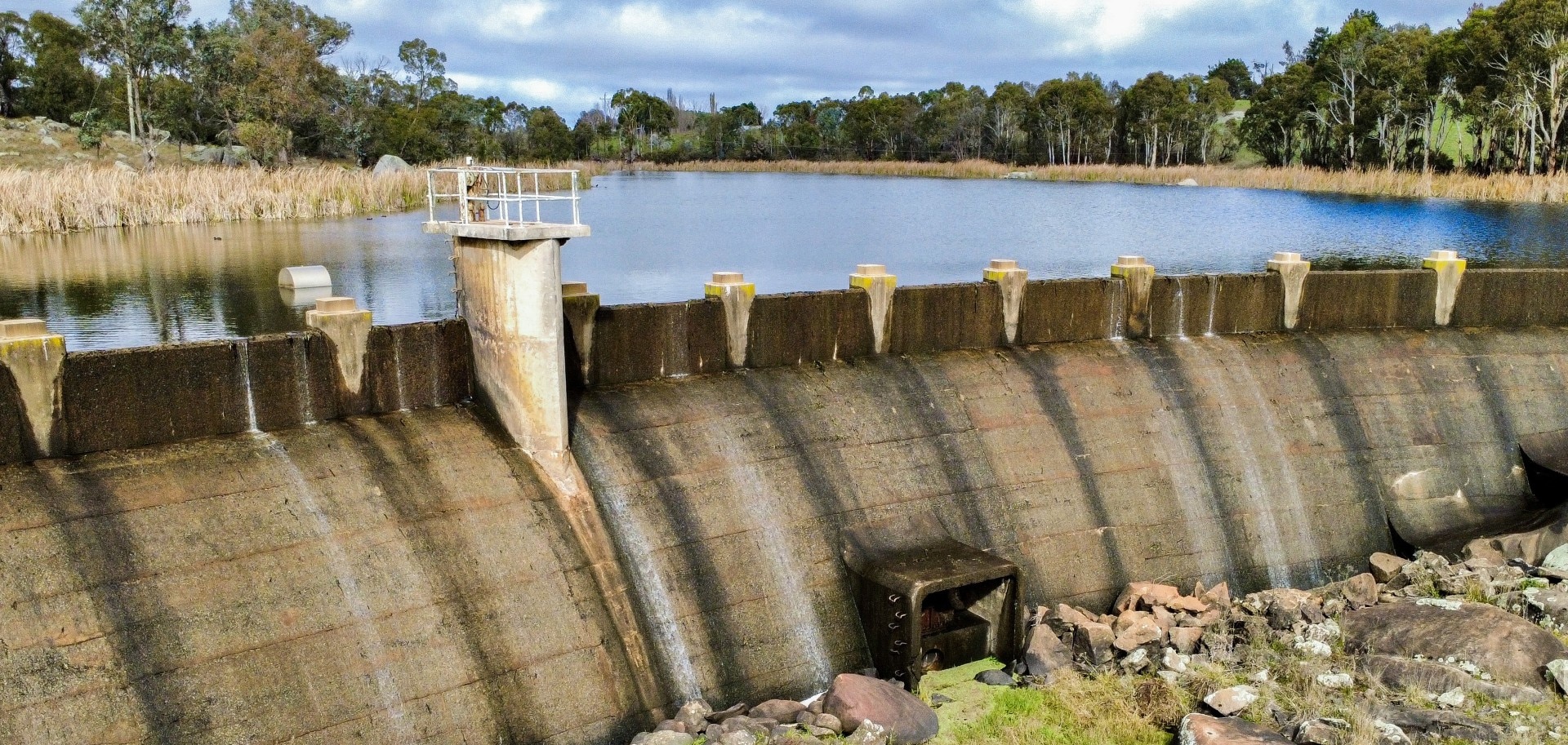 The wall of an overflowing dam