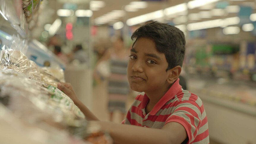 Teenage Boss Vasanth in a supermarket.