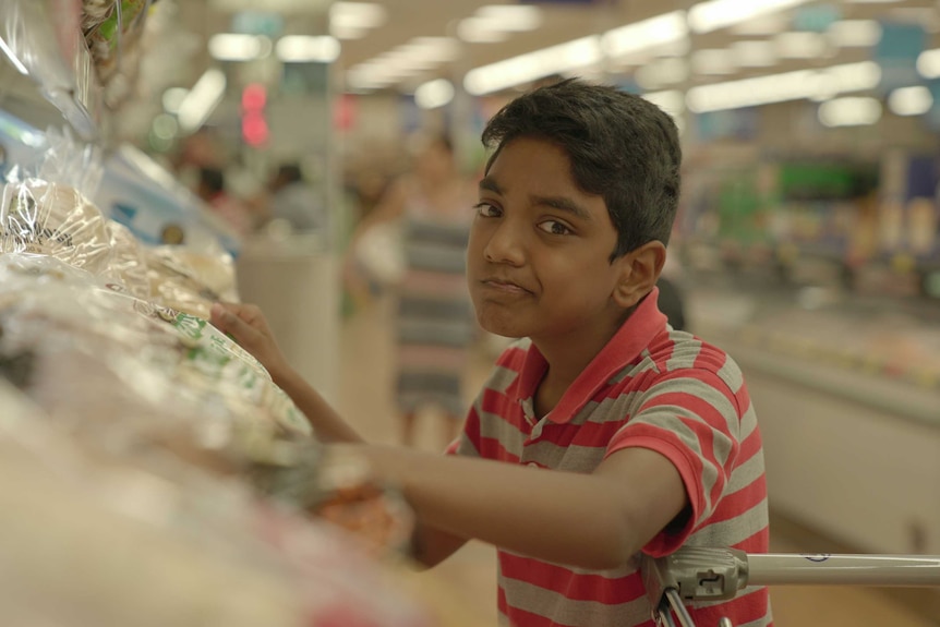 Teenage Boss Vasanth in a supermarket.