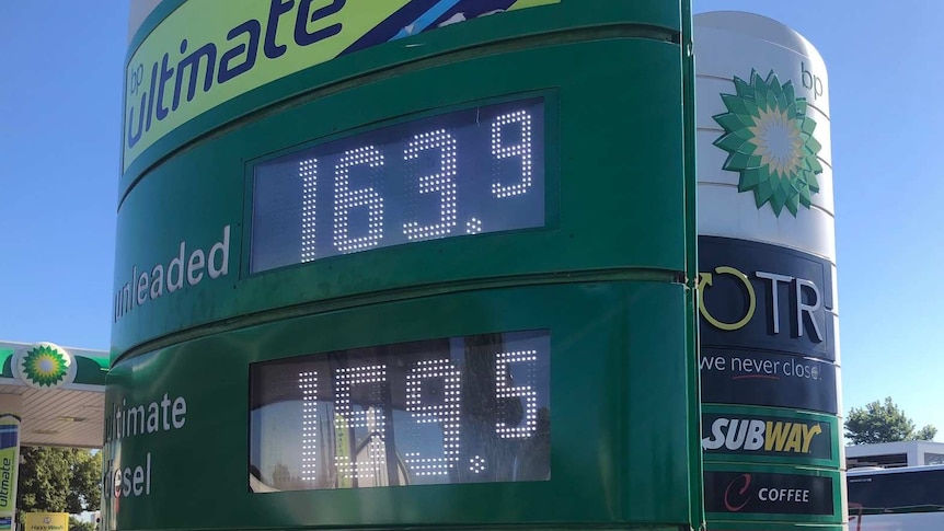 A petrol price sign showing $163.9 per litre